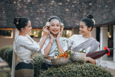Chiangmai Province, Thailand, 13 October 2022 : Beautiful women in Thai northern style costume go to temples to preserve traditions. women at northern Thai templeのeditorial素材