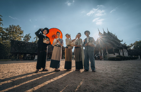 Chiangmai Province, Thailand, 13 October 2022 :  Teenagers in Thai northern style costume go to temples to preserve traditions. Men and women at northern Thai templeのeditorial素材