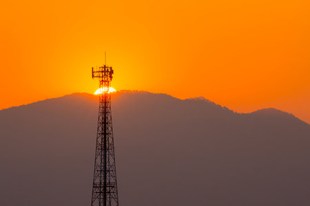 Telephone tower, radio tower during sunset. Telecommunication Tower for 2G 3G 4G 5G network, Cellular phone antenna, BTS, microwave, repeater, base station, IOT.の写真素材