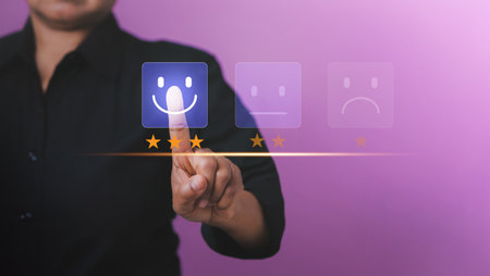 Customer service and Satisfaction, Businessman Hand choosing screen on happy Smiley face icon to give satisfaction. Concept of customer service and satisfaction. Customer service evaluation,ratingの写真素材