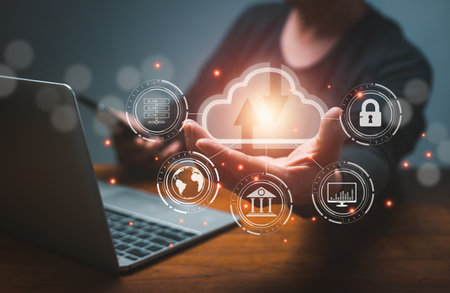 man use Laptop and Smart phone with cloud computing diagram show on hand. Cloud technology. Data storage. Networking and internet service concept. businessman hand working with virtual icon diagramの写真素材