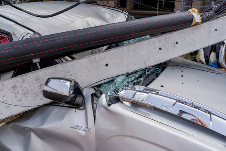 MUENG, CHIANGMAI/THAILAND MARCH  2023, 18 : High voltage electricity post damage and falling down on house and cars due to severe Storm , heavy wind and rain disaster. Building damage from stormのeditorial素材