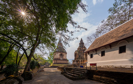 Art on ancient Buddhist architecture, Beautiful view of ancient Wat Jed Yod Temple (seven pagoda buddhist) in Chiang Mai, Thailand, inspired from Mahabodhi temple in Bodhgaya, Indiaの写真素材