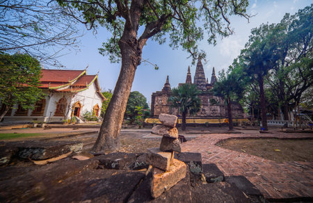 Art on ancient Buddhist architecture, Beautiful view of ancient Wat Jed Yod Temple (seven pagoda buddhist) in Chiang Mai, Thailand, inspired from Mahabodhi temple in Bodhgaya, Indiaの写真素材