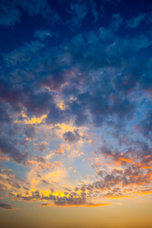 Utterly spectacular sunset with colorful clouds lit by the sun. Bright epic sky. Panorama colorful magnificent sunset in countryside, beauty nature background.Fiery sunset, colorful clouds in the skyの写真素材