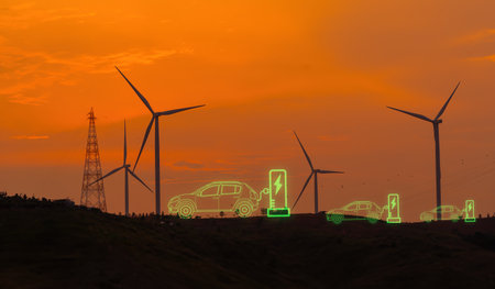 Green technology, Renewable, sustainable energy. EV car with electric vihicle charging station. Wind turbine farm. Sustainable energy for electric vehicle, Wind power. Sustainability transportation.の写真素材