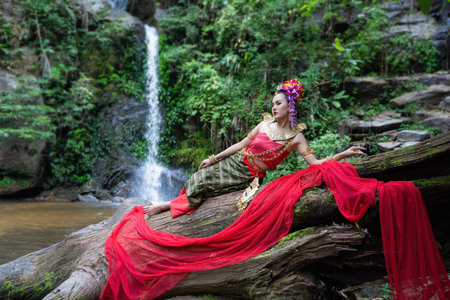 Chiang Mai, Thailand - June 24, 2023 : Beautiful Thai young woman portrait dressed in PhraPuen PhraPaeng traditional Thai dress. According to her concept in the literature of ancient Thailand.のeditorial素材