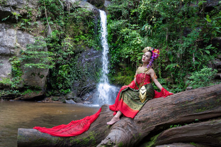 Chiang Mai, Thailand - June 24, 2023 : Beautiful Thai young woman portrait dressed in PhraPuen PhraPaeng traditional Thai dress. According to her concept in the literature of ancient Thailand.のeditorial素材