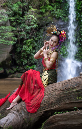 Chiang Mai, Thailand - June 24, 2023 : Beautiful Thai young woman portrait dressed in PhraPuen PhraPaeng traditional Thai dress. According to her concept in the literature of ancient Thailand.のeditorial素材