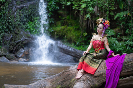 Chiang Mai, Thailand - June 24, 2023 : Beautiful Thai young woman portrait dressed in PhraPuen PhraPaeng traditional Thai dress. According to her concept in the literature of ancient Thailand.のeditorial素材