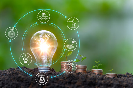 Energy saving light bulb and save world concept, sustainable development. Ecology concept. Environmental protection, renewable, sustainable energy sources concept.Environmental concepts on Earth Dayの写真素材