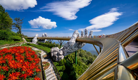 Bana Hills, Danang Vietnam - AUGUST , 2023:Golden bridge on the top of the Ba Na Hills, Danang city, the famous tourist attraction in central vietnam. a pair of giant handsのeditorial素材