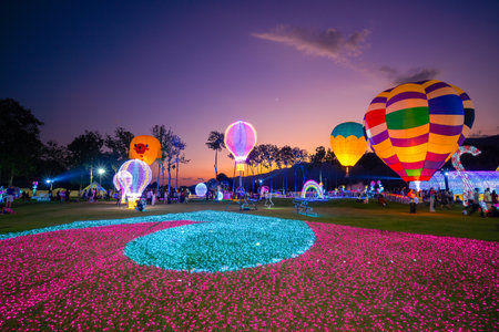 CHIANG MAI, THAILAND - December 15, 2023: Hot air balloons in the flower garden in evening twilight in Loy Krathong Festival 2024. Colorful Balloons in nightのeditorial素材