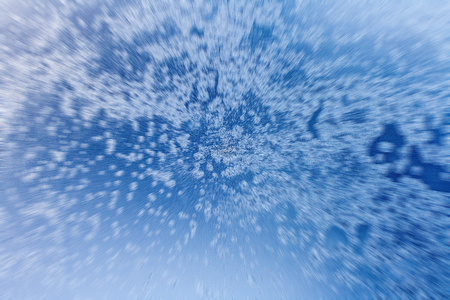 blue ice background with zoom effect.  Radial blur from the centerの写真素材