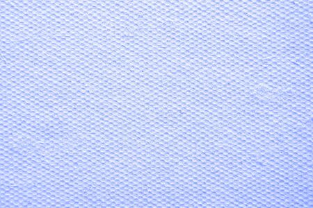 Abstract background for design. Perforated porous surface. Blue microfiber textile closeup.の写真素材