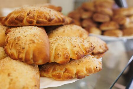 Homemade cake. Fresh rolls are on a platter. Close up. Top viewの写真素材