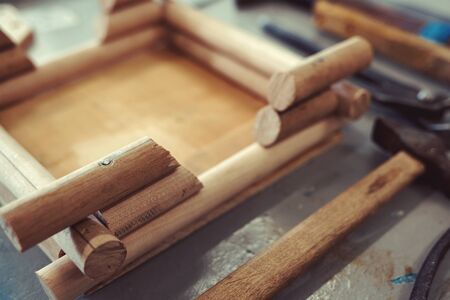 Care and care of birds. Production of wooden feeders for migratory birdsの写真素材