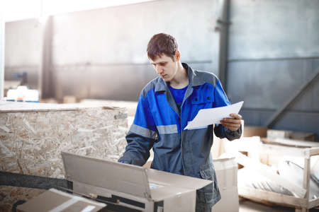 Warehouse worker performs an inventory of the goods