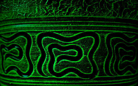 Close-up of ancient patterns on a clay pot or vessel. Abstract background with patterns.