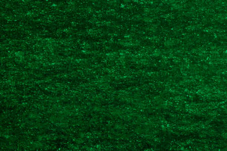 Dark abstract background for the design. Empty green uniform surface. Blank for an ad or...