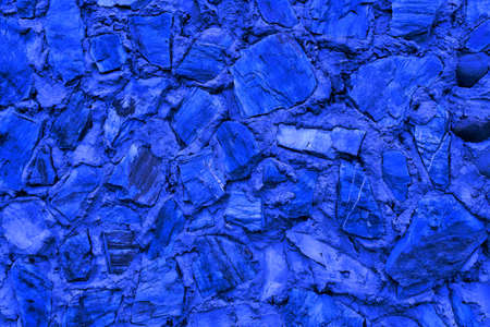 Abstract background of many large stones. Empty stone surface of blue color. Blank for design.の写真素材