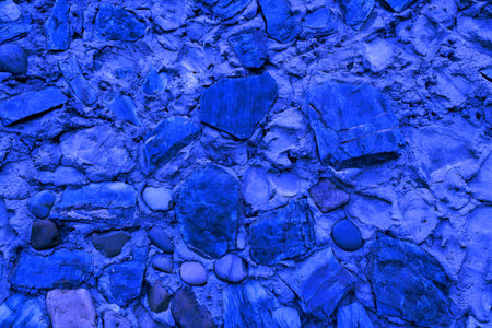 Abstract background of many large stones. Empty stone surface of blue color.の写真素材