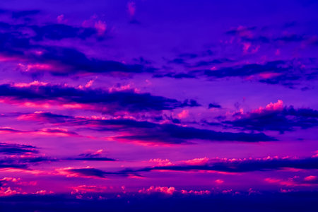 Pink sky with beautiful clouds. Charming sunset landscapeの写真素材