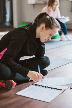 A young girl at a master class or training.
