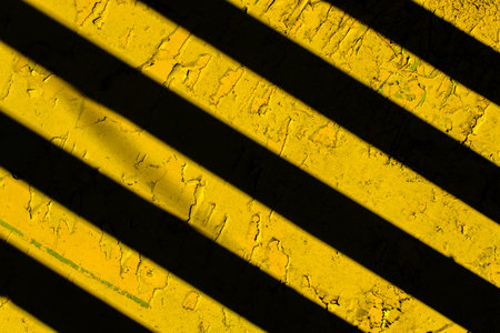 Yellow background with black diagonal stripes.の写真素材