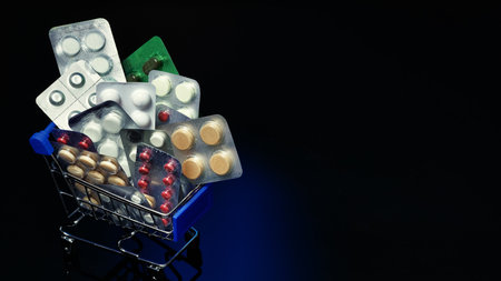 A lot of pills are in the food cart. Blisters with medicines on a dark background. Purchase and supply of medicines.の写真素材