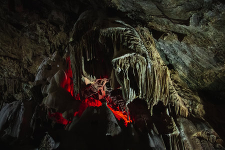 It is an underground cave with stalactites and stalagmites and a glowing crater.