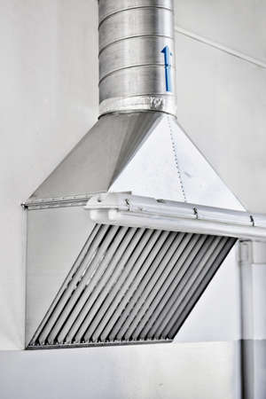 Cooker hood in the production shop. Installation of a ventilation system in industrial premises