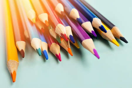 Sharp colored pencils for drawing lie on the table. Accessories for creativity and artists. background. Minimalism and aesthetics.の写真素材
