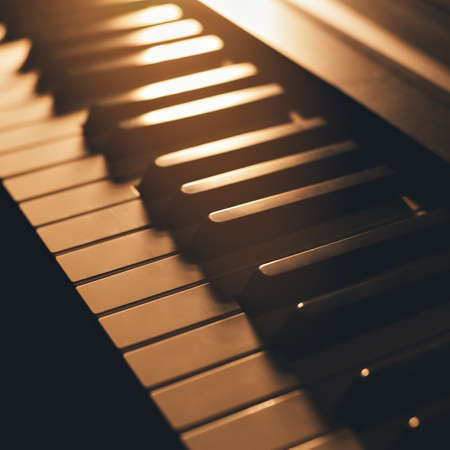 Piano keys close-up. Stylish tinted image. Background. Learning to play musical instrument.の写真素材