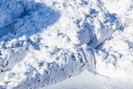 Bunch of close-up snow. Cleaning of streets from snow in winter. Removal of snow from streets. Backgroundの写真素材