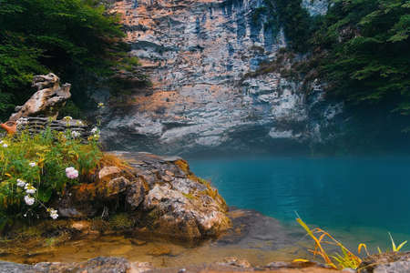 Beautiful view of turquoise lake in mountains. Calm landscape. Bay in mountains.の写真素材