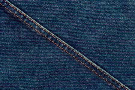 Fashionable denim with stitching. Textile material. Empty surface with space to copy. Part of...