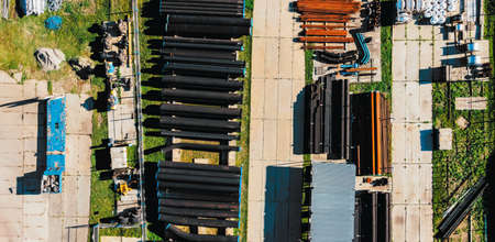 New pipes for gasification of different diameters are stored in open warehouse. View from above. Backgroundの写真素材
