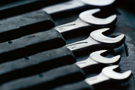 Set of wrenches for repairing cars and equipment. Close-up of locksmith equipment. Real background.