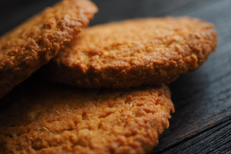 Delicious oatmeal cookies are on table. Healthy dessert for tea and breakfast close-up. Cereal food.の写真素材