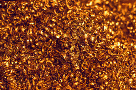 Yellow metal shavings from lathe close-up. Abstract industrial background. Golden fleece..の写真素材