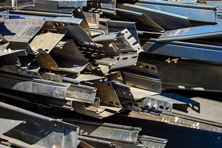 Scrap. Close-up of construction metal waste dump. Pile of pipes and galvanized profile. Background..の写真素材