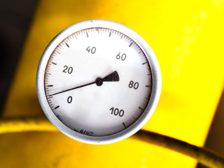 Pressure gauge with arrow shows gas pressure in pipe. Industrial pressure measurement sensor close-up..の写真素材