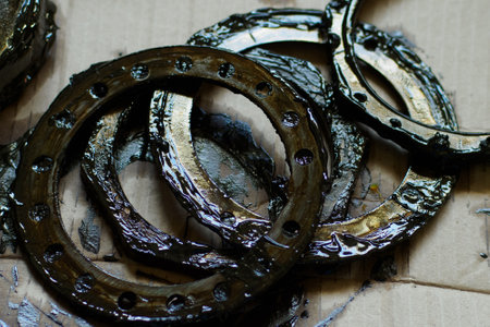 Car parts, rings and gaskets in lubricant lie on cardboard paper. Supply or import substitution of parts. View from top..の写真素材