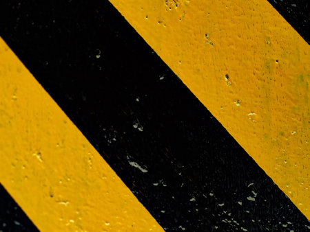 Abstract background. Black yellow oblique stripes. Industrial background..の写真素材