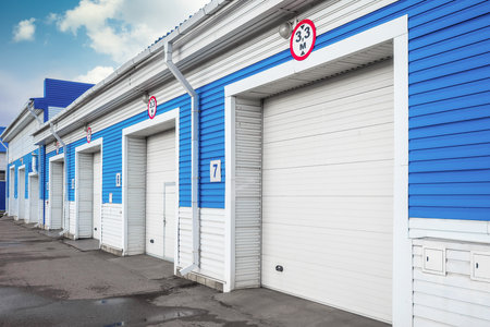 Modern garage with automatic gates for trucks and large cars. Exterior view..の写真素材