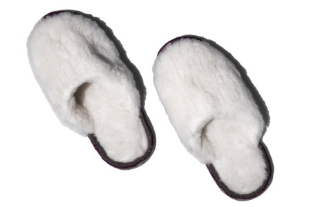 Handmade woolen slippers in isolation on white background. Soft comfortable shoes for home..の写真素材