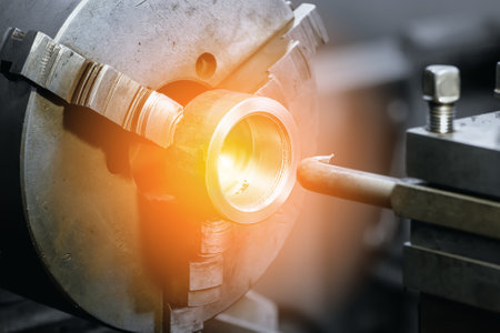 Type of metal processing lathe part. Industrial background. Solar glare or illumination..の写真素材