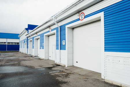 Modern garage with automatic gates for trucks and large cars. Exterior view..の写真素材
