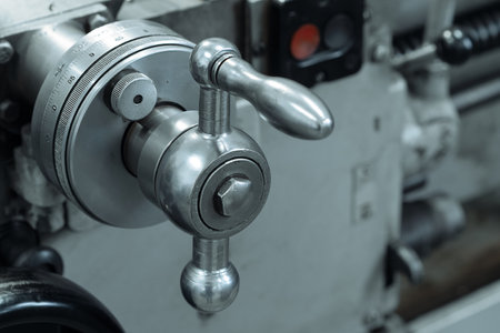 This is part of close-up metal lathe. Industrial equipment for metal processing. Milling machine handle..の写真素材